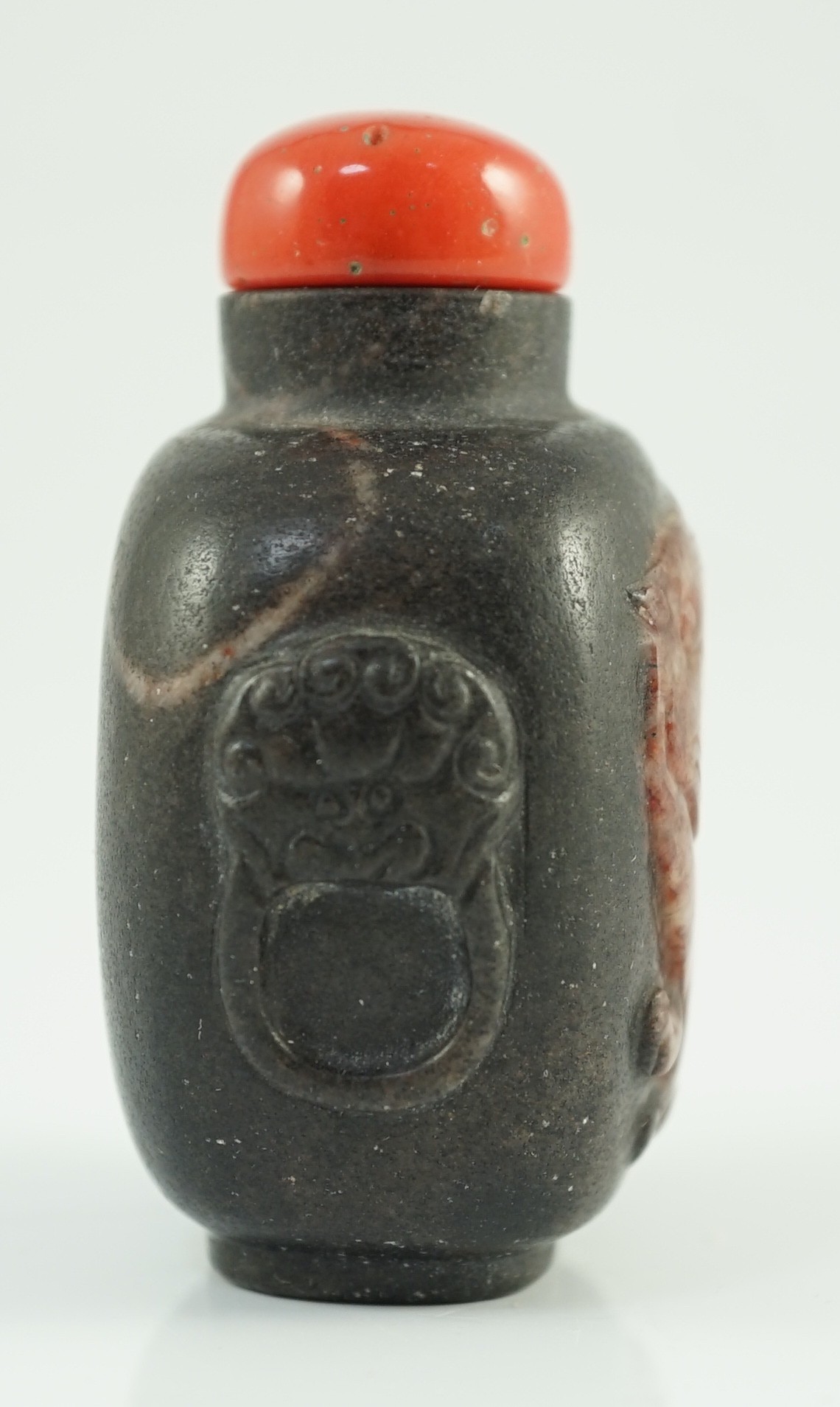 A Chinese two colour marble cameo ‘tiger’ snuff bottle, 19th century, 5.4cm high